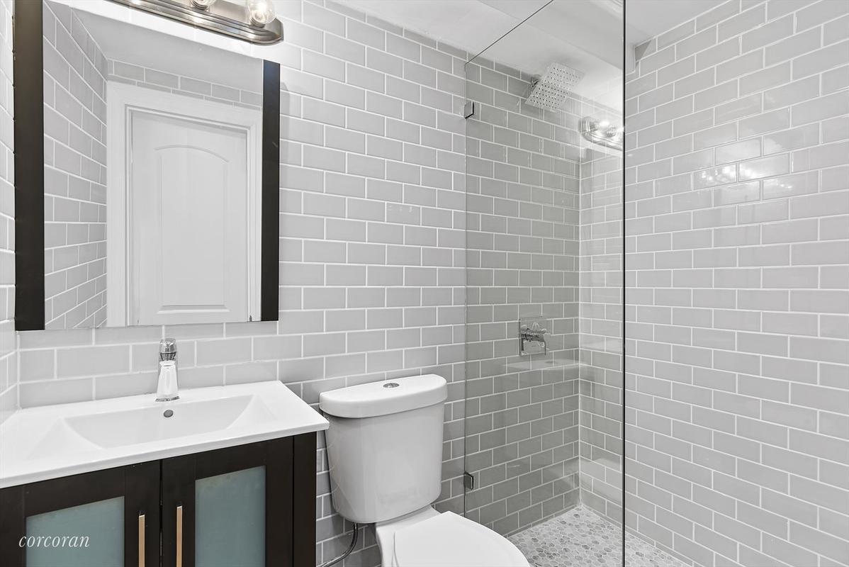 A renovated two family in Brooklyn near trains (and a car body shop)